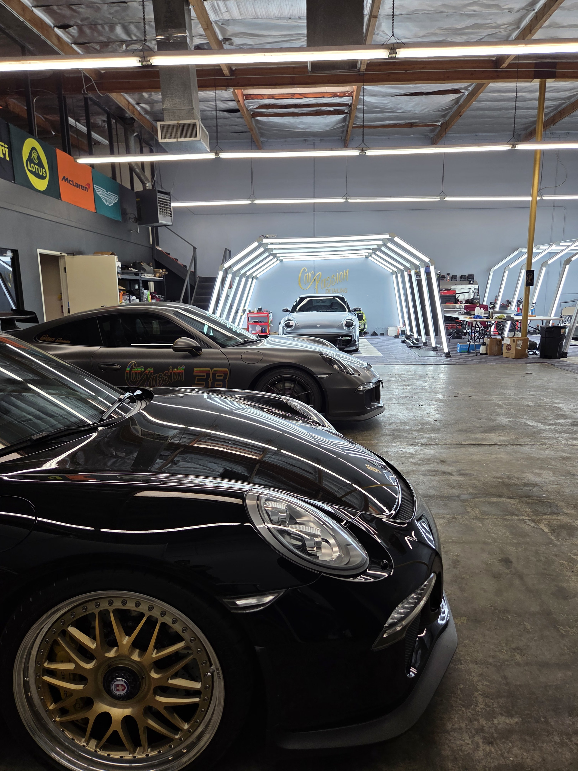 Black Porsche in a professional detailing studio